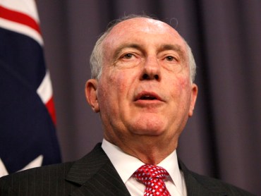 Warren Truss addresses the media in Canberra
