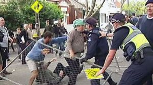 Protesters knocked down a fence around a temporary drilling site and clashed with police on December 18.