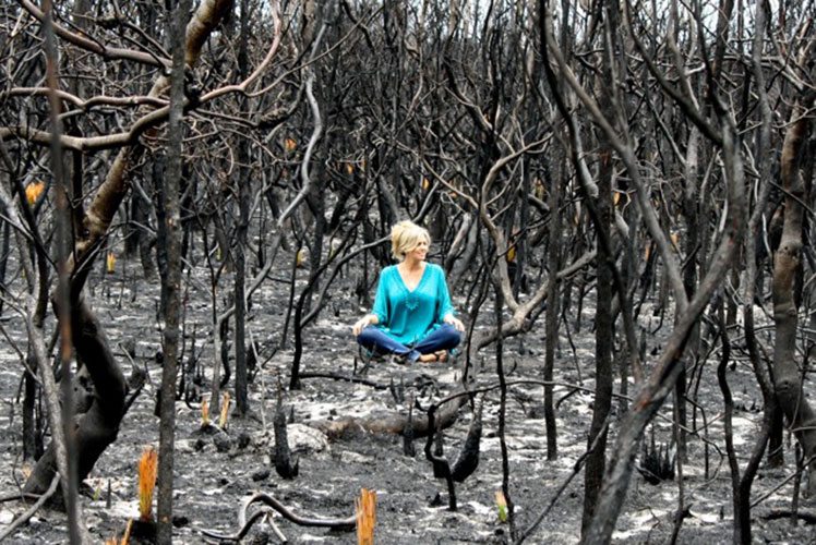 Emily Rooney poses amid the aftermath of the Canberra bushfires. Source: Supplied.