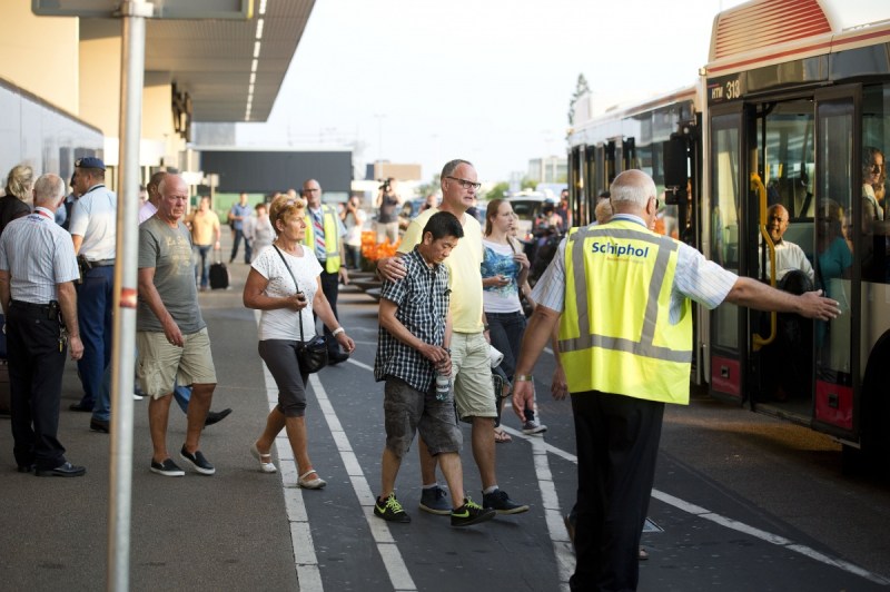 Relatives of passengers of Malaysia Airlines flight MH17 get onto a bus at Schiphol Airport near Amsterdam.