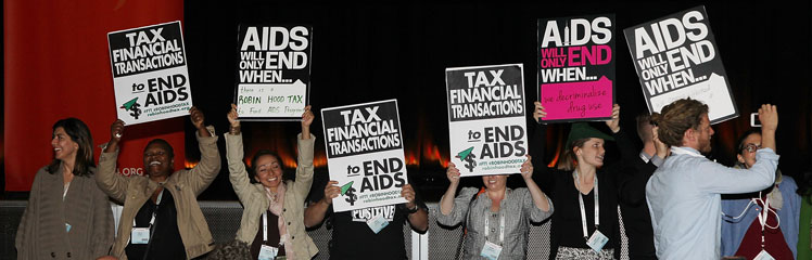 Protesters interrupt former President Bill Clinton at the AIDS conference. Photo: Getty