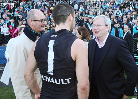 One of these men is the messiah, the others are Port skipper Travis Boak and former PM Kevin Rudd. Photo: Getty