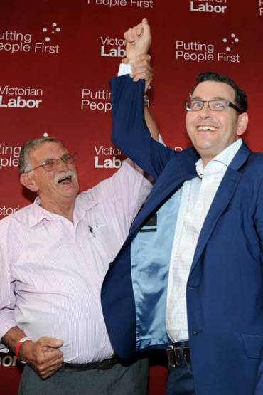 Daniel Andrews celebrates his election win with his father Rob. Photo: AAP