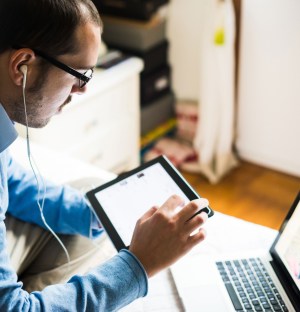 Man multitasks technology