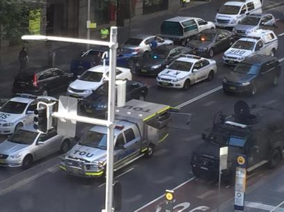 Police vehicles surround the siege area. Photo: Twitter