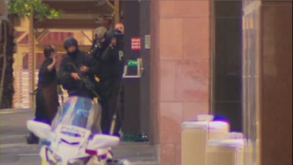 A Lindt worker escapes from the building. Photo: Twitter @Sandra_Sully