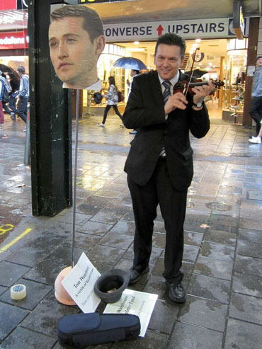 Busking 'for' Tom Waterhouse in 2013 after the entrepreneur complained about the difficulties of running a gambling business in Australia. Photo: AAP