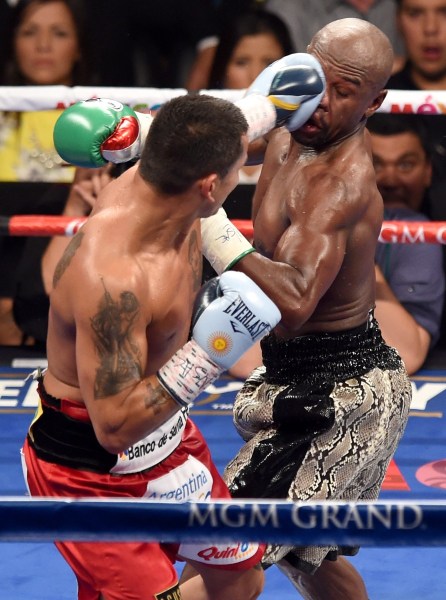 Floyd's handed out many hits during his career - but here, he takes one in his last bout. Photo: Getty