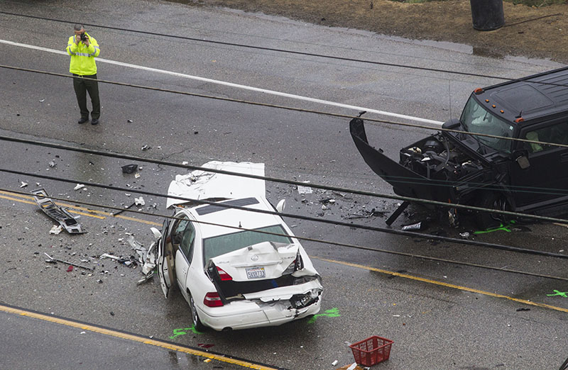A sheriff at the scne of the fatal crash in Malibu. Photo: AAP 