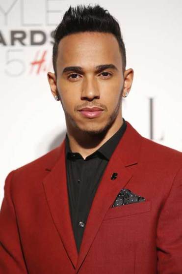 Lewis Hamilton in a suit that's almost as sharp as his driving. Photo: Getty