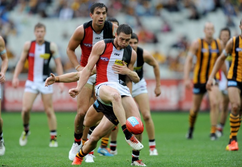 Jack Steven of St Kilda is tackled by Mitchell Hallahan of Hawthorn. Photo: AAP