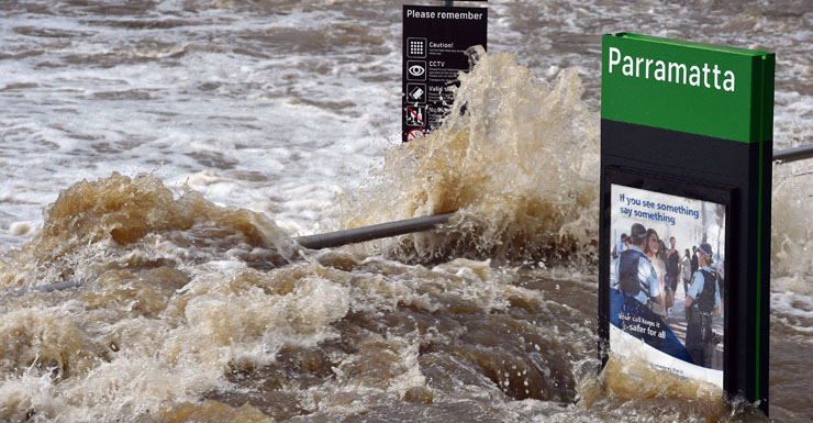 Flood waters enter the Parramatta ferry wharf in Sydney.