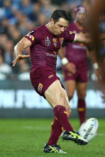 Cooper Cronk launches the decisive field goal in the 74th minute. Photo: Getty