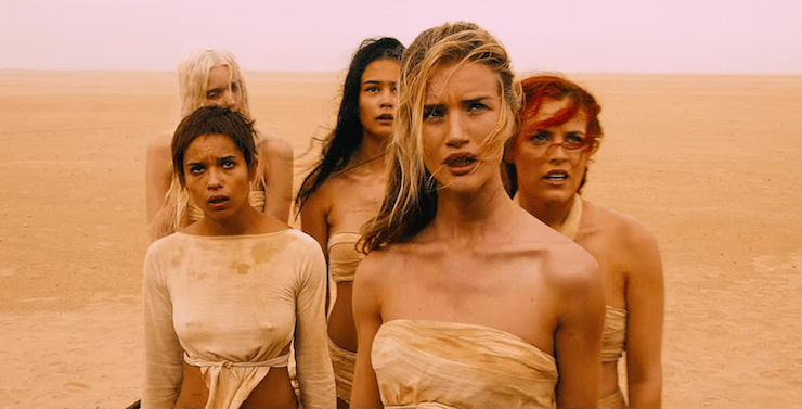 (L-R): Abbey Lee Kershaw, Zoe Kravitz, Courtney Eaton, Rosie Huntington-Whiteley and Riley Keough play the wives.