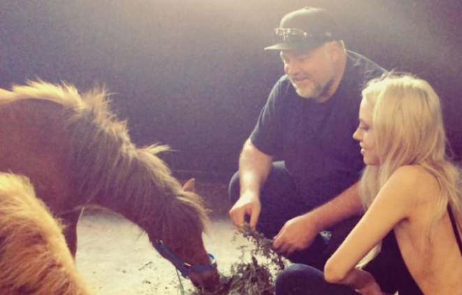 The couple pose with some of their ponies. Photo: Instagram @imogen_anthony 