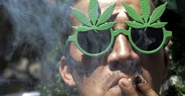 man smokes marijuana. Getty