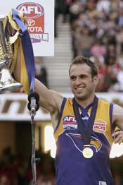 The Premiership captain lifts the Cup. Photo: Getty