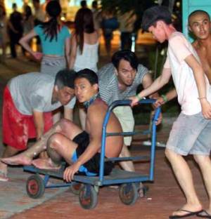 Revelers turned to rescuers as half a party engulfed in flames at water park. Photo: AAP