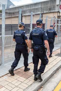 Queensland police walk the streets of Brisbane. Photo: Getty