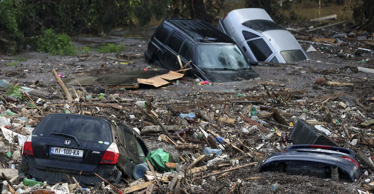 Cars submerged in flood water.