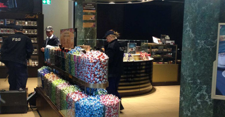 Forensic police examine the Lindt Cafe after the windows were broken by a vandal.