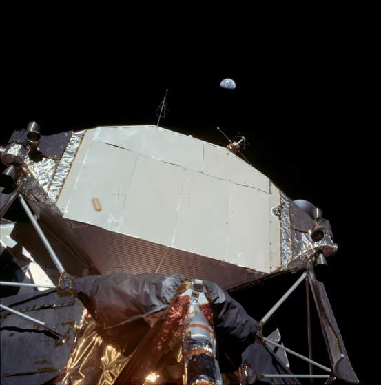 You can see the earth out in the distance, hovering above the lunar landing module. Photo: NASA