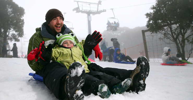 Craig and Cooper Hecht on the toboggan during a cold snap at Mt Buller.