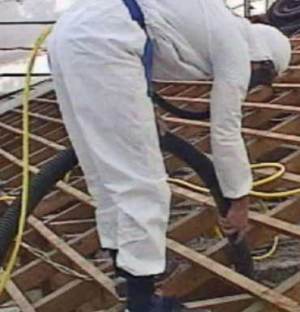 Workers go to great lengths to remove the dangerous material, but some houses may need to be demolished. Photo: ABC