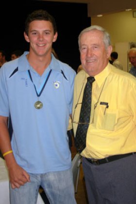 The bowler with former coach John Muller (R). Photo: Supplied