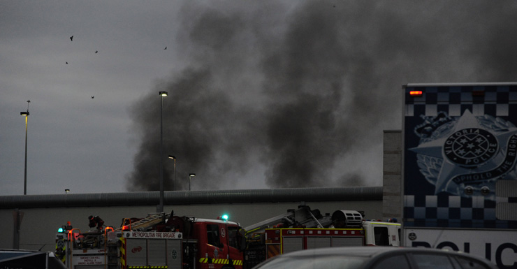 Smoke rising from the prison where inmates were rioting over a smoking ban.