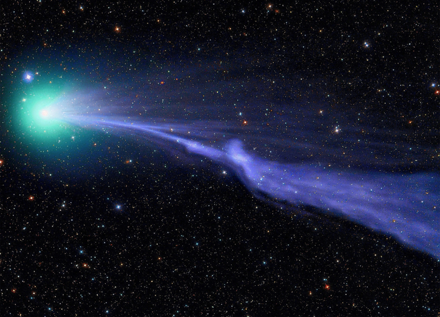 Comet Lovejoy sails through the solar system in a green haze leaving cometary dust in its wake.
