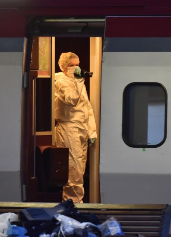 Investigators gather evidence on the train, which was carrying 550 passengers. Photo: Getty