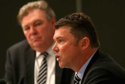 Grim faced: Collingwood CEO Gery Pert faces the media with football boss Neil Balme. Photo: Getty