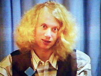 (FILES) File photo of Martin Bryant, the 28-year-old gunnman who massacred 35 people and injured 18 others during a shooting rampage in the historic settlement of Port Arthur on 28 April, appears on a video screen during his first court hearing in Hobart 22 May. Survivors and relatives of Port Arthur massacre victims were bracing themselves 27 April to relive a day of unbearable horror as they return to the historic site to commemorate its first anniversary on 28 April.