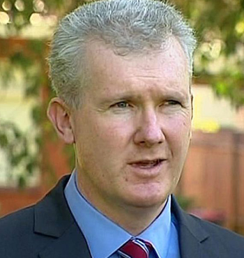 Tony Burke says it is a "justifiable expectation" his children should not have flown business class.