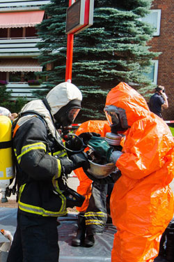 Firefighters are decontaminated. Photo: AAP