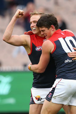 Vince (L) is hugged by Melbourne team-mate Angus Brayshaw. Photo: Getty