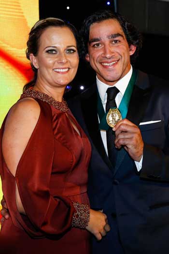 Thurston soaks up the victory with partner Samantha Lynch. Photo: Getty