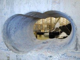 Burglars used cutting equipment to drill through a thick concrete wall.