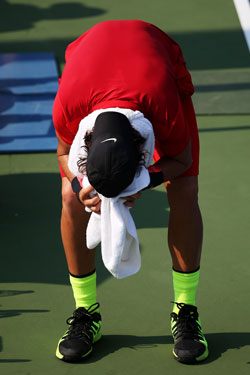 Thanasi Kokkinakis reacts to his round one withdrawal after suffering a cramp. Photo: Getty