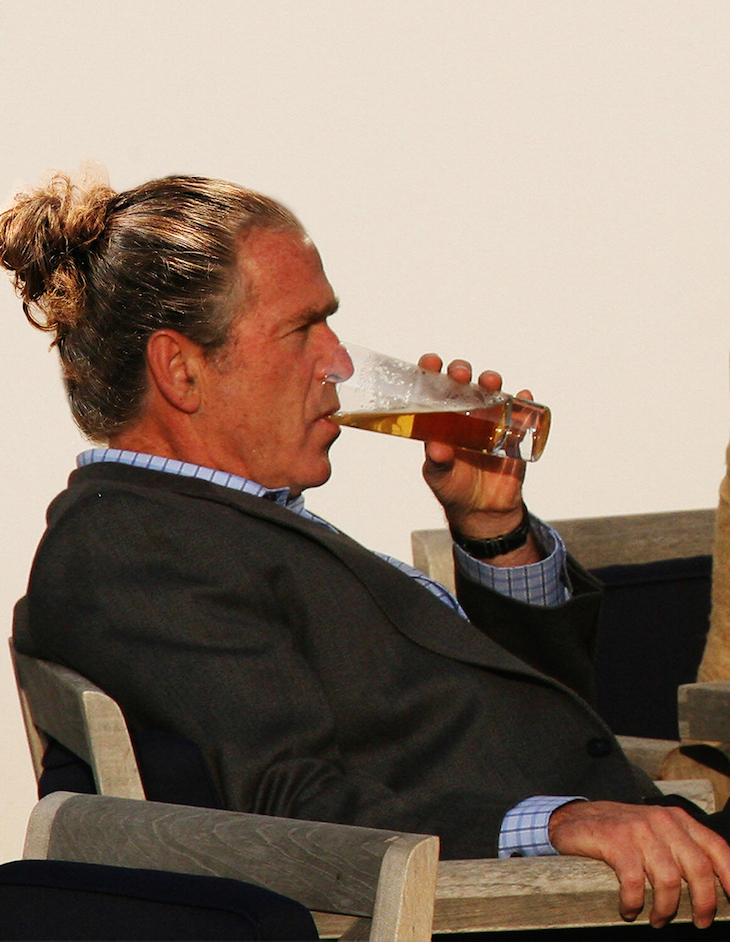 HEILIGENDAMM, GERMANY: US President George W. Bush takes an aperitif on the terrace of the Kempinski Grand Hotel in Heiligendamm, northeastern Germany, following a working session of the G8 Summit 07 June 2007. German Chancellor Angela Merkel is hosting the meeting as the chairman of the G8, which also includes Britain, Canada, France, Italy, Japan, Russia and the United States. AFP PHOTO DDP/DAVID HECKER GERMANY OUT (Photo credit should read DAVID HECKER/AFP/Getty Images)