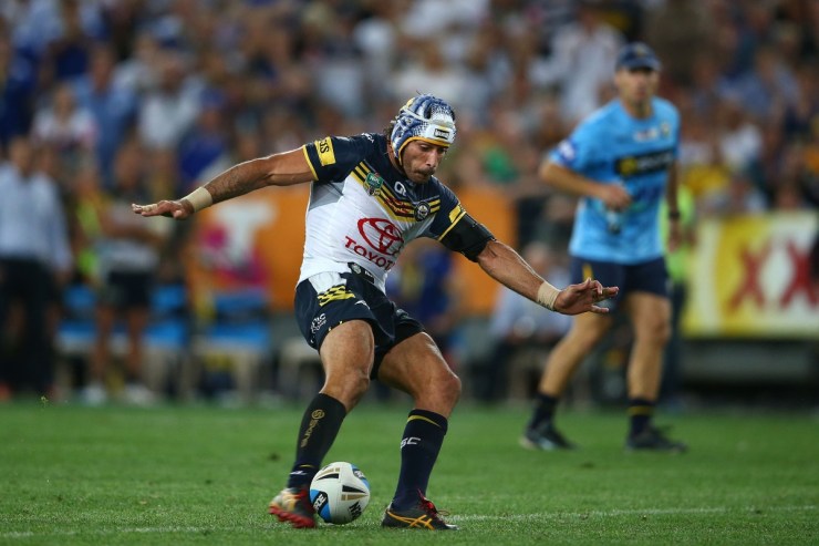 Sweet contact: Thurston kicks the winner in extra-time. Photo: Getty