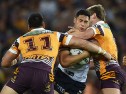 BRISBANE, AUSTRALIA - SEPTEMBER 25: Roger Tuivasa-Sheck of the Roosters is tackled during the NRL First Preliminary Final match between the Brisbane Broncos and the Sydney Roosters at Suncorp Stadium on September 25, 2015 in Brisbane, Australia. (Photo by Matt Roberts/Getty Images)