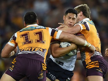 BRISBANE, AUSTRALIA - SEPTEMBER 25: Roger Tuivasa-Sheck of the Roosters is tackled during the NRL First Preliminary Final match between the Brisbane Broncos and the Sydney Roosters at Suncorp Stadium on September 25, 2015 in Brisbane, Australia. (Photo by Matt Roberts/Getty Images)