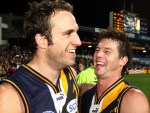 Judd and Cousins celebrate a round 15 win in 2006.