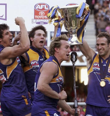 Andrew Embley, Cousins, Daniel Chick Chris Judd celebrate their 2006 Grand Final win against Sydney.