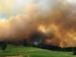 Plumes of smoke rise near Lancefield, in central Victoria.
