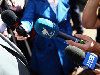 SYDNEY, AUSTRALIA - MAY 06: News microphones of Seven, SBS and Nine are seen outside SBS Headquarters on May 6, 2015 in Sydney, Australia. Garbage trucks from Blacktown blockade SBS headquarters in protest of "Struggle Street" the controversial new show to be aired on the channel. (Photo by Ryan Pierse/Getty Images)