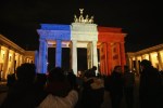 Mourners lay flowers and candles in front of the Brandenburg Gate in Germany. Photo: Getty