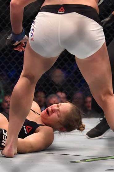 The fight was over 59 seconds into round two when a Holm kick connected with Rousey's jaw. Photo: Getty